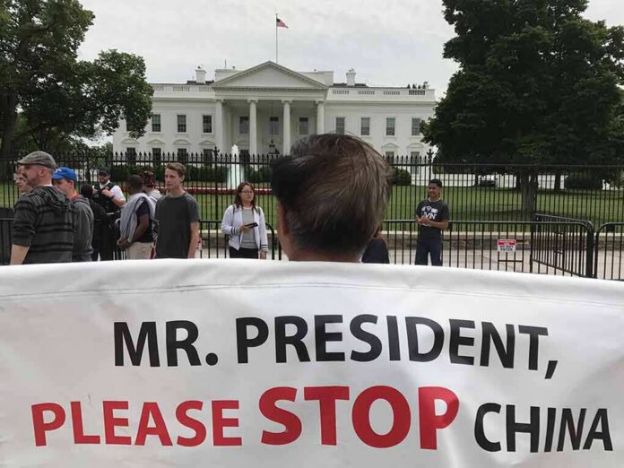 shutterstock_784076623 Protester holding a large banner in front of the White House