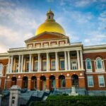 Mayor Blasted for Taxpayer-Funded Program That Discriminates U.S Citizens Massachusetts State House with golden dome and columns
