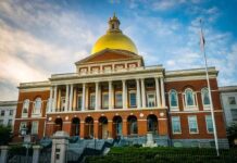 Mayor Blasted for Taxpayer-Funded Program That Discriminates U.S Citizens Massachusetts State House with golden dome and columns
