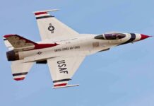 F-16 CRASHES Over Michigan, Pilot Vanishes Mid-Air USAF fighter jet in flight against clear sky