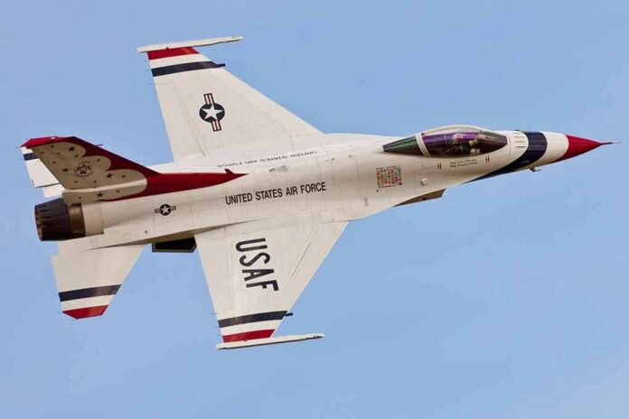 shutterstock_92964169 USAF fighter jet in flight against clear sky