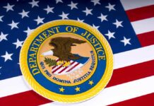 DOJ Strips Citizenship in Largest Denaturalization Effort in History Department of Justice seal on American flag background