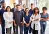 Group of healthcare professionals posing in a hospital corridor