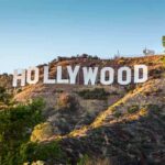 Kardashian Slap Threat Stuns Oscar Winners Fans Hollywood Sign on a sunlit hillside