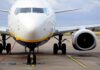 Passenger jet parked on tarmac front view