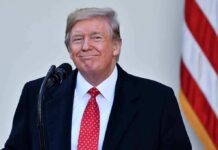 Donald Trump at a podium with a microphone