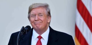 Donald Trump at a podium with a microphone
