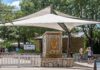 Dallas Zoo entrance sign under large shade canopy