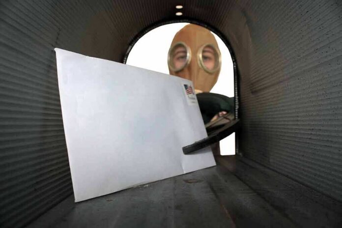 Letter inside a mailbox with a person wearing a gas mask outside