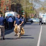 Botched Robbery: Migrant SHOOTS Off-Duty Cop Police officers and investigators at a blocked city street scene