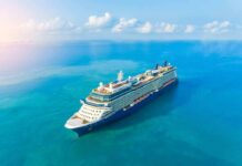 Passengers Stranded As Fuel Bill Sinks Cruise Voyage Cruise ship sailing on calm turquoise sea