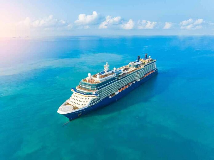 Cruise ship sailing on calm turquoise sea