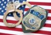 Dem Candidate Hires ILLEGAL Migrant – Immediately Arrested! ICE officer badge and handcuffs on an American flag