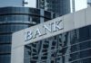 Bank building facade with large sign and glass windows