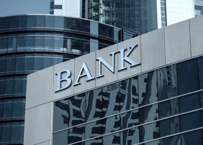 Bank building facade with large sign and glass windows
